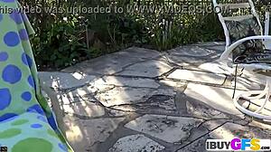 Hot brunette babe fingers pussy with dildo outdoors closeup