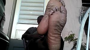 i'm a bear black master showing my big feet after work needing a slave