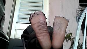 i'm a bear black master showing my big feet after work needing a slave