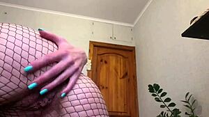Girl in fishnets masturbates solo, squirting wet pussy
