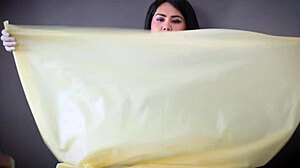 In the hospital, a nurse in latex gloves tends to her patient with fetishistic care.