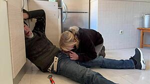 Mature Blonde Wife Receives Assistance from Plumber in the Kitchen