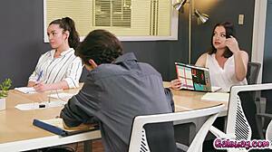 Kenzie Taylor moans loudly as her butt plug teases her during the meeting.