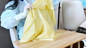 In the hospital, a nurse in latex gloves tends to her patient with fetishistic care.