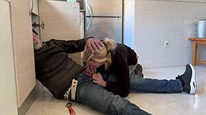 Mature Blonde Wife Receives Assistance from Plumber in the Kitchen