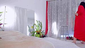 Curvy milf teases with upskirt views of her hairy beaver in red dress.