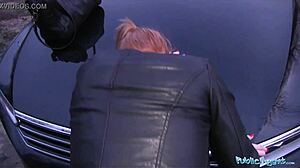 innocent ginger girl interacts with agent over car bonnet