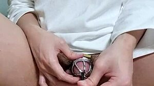 Korslaveman in chastity belt plays with urethra toys to cum.