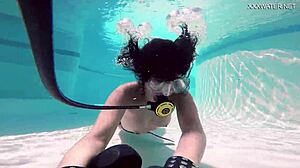 brita piskova dives deep, masturbating underwater in tight swimming pool