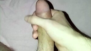 a young guy plays with his dick solo