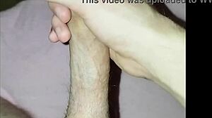 a young guy plays with his dick solo