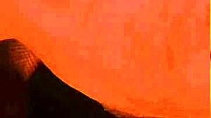 She teases the camera with pillow play.