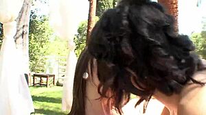 Two lesbian stepsisters lick each other outdoors