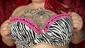 Sexy bbw woman massages her big natural tits with oil.