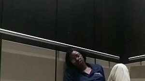 Ebony babe gets fingered and cums in public elevator scene