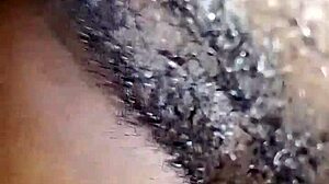 this pantless ebony woman spreads her wet pussy on the bed