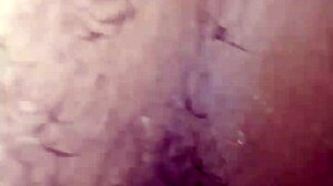 this pantless ebony woman spreads her wet pussy on the bed