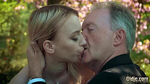 young blonde chats with old man during casual meetup