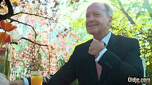 young blonde chats with old man during casual meetup