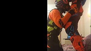 This gay dude gives a motocross blowjob in fetish costumes.