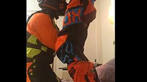 This gay dude gives a motocross blowjob in fetish costumes.