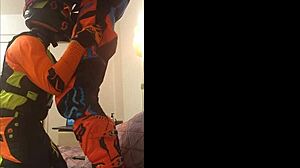 This gay dude gives a motocross blowjob in fetish costumes.