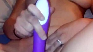 A young woman explores solo masturbation in private.