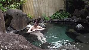 Hey, watch this cute Asian babe fall for steamy hot spring sex!