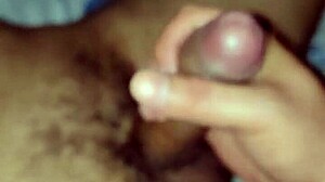 gay guy playfully sucks on a big toy in suggestive way