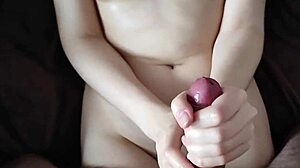 Girlfriend jerks big cock in POV, cum splatters her cute ass