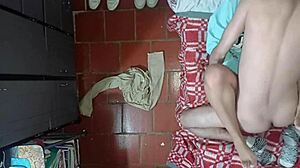 camera captures older stepson interacting with stepmother from ceiling view during their encounter