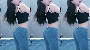 Pretty Chinese girl dancing with vibrator on cam