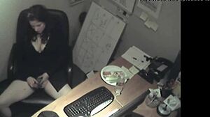 secretary in uniform rubs her boobs and masturbates to orgasm in the office