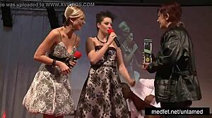 female and male strippers tease the audience with undressing and dancing