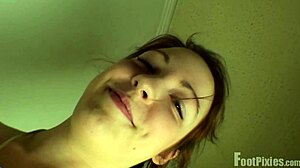 Pixie showcases red lingerie in a photoshoot setting