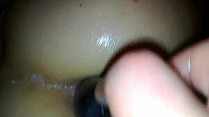 Sexy amateur brunette engages in homemade anal fisting and assfucking with toys, detailed scene