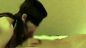 Beautiful woman in Chinese dress stimulates penis with handjob and blowjob