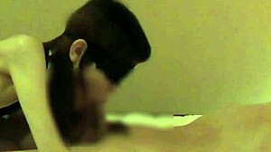 Beautiful woman in Chinese dress stimulates penis with handjob and blowjob