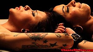 Lezdom mistress intensely dominates and binds her submissive lesbian partners in bondage