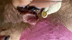 hey, check out this extreme big clit rubbing on wet hairy pussy
