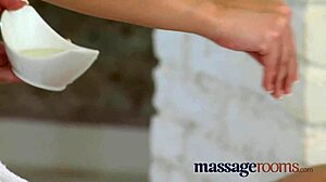 in the massage room, the busty masseuse gives a foot rub and oiled sex session