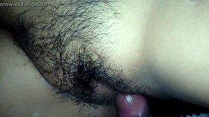 My wife spreads her legs wide, revealing her hairy vagina for a close look.