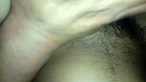 My wife spreads her legs wide, revealing her hairy vagina for a close look.