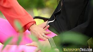 is this bizarre lesbo strapon threesome ending with golden shower outdoors?