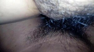 My wife spreads her legs wide, revealing her hairy vagina for a close look.