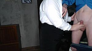 Slutty secretary in stockings jerks off her boss's big cock, indulging in kinky fetish play.