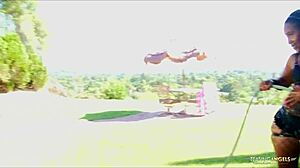 The ebony woman in sexy lingerie makes the guy horny.