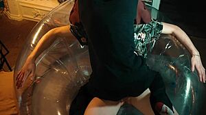 Two sweet guys share an inflatable chair.