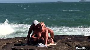 Busty blonde Tarra White handles big cocks in intense interracial ocean threesome