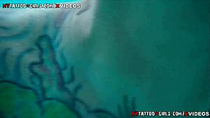 Blonde with big tits lounges by the pool